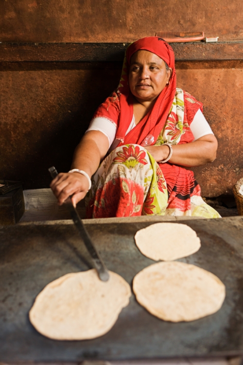 Indian woman cooking chapati